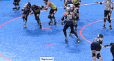 a group of roller derby players are playing a game and one of them is wearing a number 505 jersey