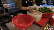 a person in a black apron is preparing food in a kitchen and the words made in animotica are on the bottom of the screen