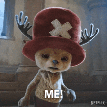 a stuffed animal with antlers and a hat that says me on it
