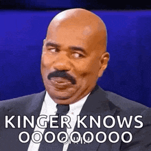 a bald man with a mustache is wearing a suit and tie and says kinger knows .