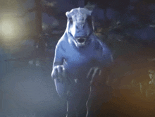 a drawing of a dinosaur with its mouth open in the dark