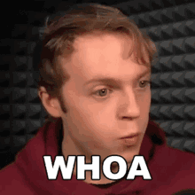 a man wearing a red hoodie says whoa