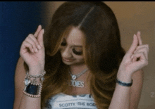 a woman wearing a scotty the body shirt