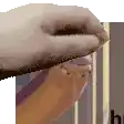 a close up of a person 's hand holding a piece of cake .