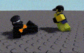 two lego figures are standing next to each other on a brick floor