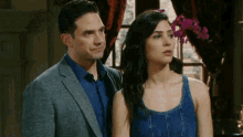 a man and a woman are standing next to each other