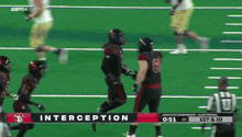 a football game is being played on espn and the players are running on the field