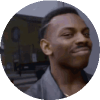 a man with a mustache is smiling in a circle