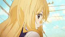 a close up of a girl 's face with a blue sky in the background