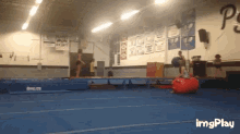 a gym with a sign on the wall that says " spirit "