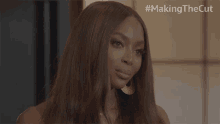 a close up of a woman 's face with the hashtag #making the cut above her
