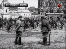 a black and white photo of soldiers and a sign that says ' 19 ' on it