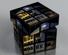 a rubik 's cube with a picture of a building and the letters cdc on it