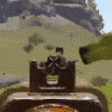 a blurred image of a person looking through a rifle sight .