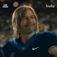 a man in a football uniform is smiling in front of a hulu ad
