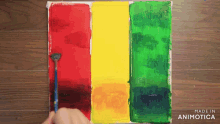 a painting of red yellow and green with the words made in animatica