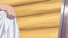 a person is holding a white cloth in front of a wooden wall with hiro saka written on the bottom right corner