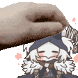 a close up of a hand holding a cartoon character 's head .