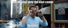 a man adjusts his glasses with a caption that says me moving onto the next comm ( known )