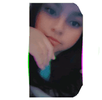 a girl 's face is shown with a purple and green border