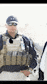 a blurry picture of a man in a military uniform standing next to a woman .