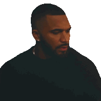 a man with a beard is wearing a black shirt and earrings