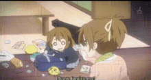 two anime girls are sitting at a table and one of them is asking for forgiveness
