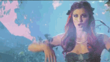a pixelated image of a woman in a mermaid costume in the water