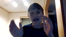 a blurry picture of a person with their mouth open and their hands outstretched