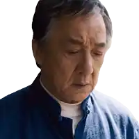 a man with his eyes closed wearing a blue jacket