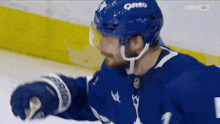 a hockey player wearing a helmet with oreo on it