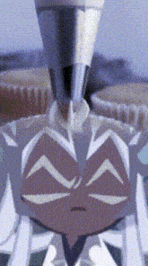 a close up of a cartoon character 's face with a piping nozzle .