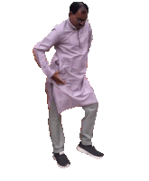 a man in a purple shirt and grey pants is standing with his hands on his hips
