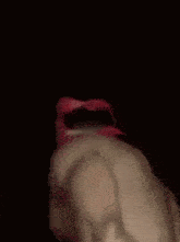 a close up of a person 's mouth with red lipstick .
