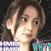 a close up of a woman 's face with the words " hmm hmm why ? " behind her