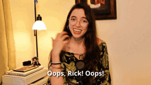 a woman says oops rick oops in front of a laptop