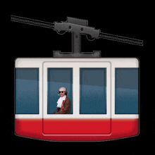a man wearing headphones stands in a red white and blue gondola