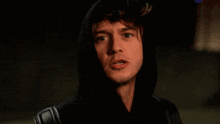 a person in a hooded jacket with a backpack