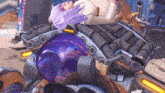a woman with purple hair is laying on top of a large purple object