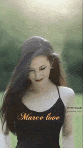 a woman wearing a black tank top with the words marce love written on it