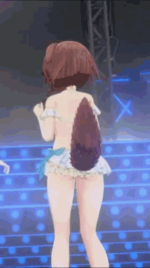 a girl with a dog tail is dancing on a stage .