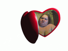 two heart shaped mirrors one of which has a man in a cat hat