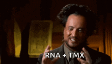 a man in a suit and tie is saying rna + tmx .