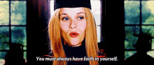 a woman wearing a graduation cap and gown says you must always have faith in yourself