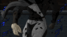 a person in a black and white outfit is standing in a dark room with a shadow on their pants .