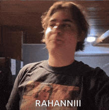a man wearing a t-shirt with the word rahannii on it