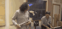 a man playing a trumpet next to a man playing a piano