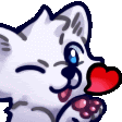 a white cat is holding a red heart in its mouth .