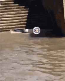 a flooded area with a city of man city logo on it