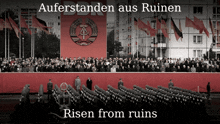 a large crowd of people are gathered in front of a large red banner that says ddr